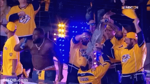 Man In Yellow Jersey Lewan Surrounded By People GIF