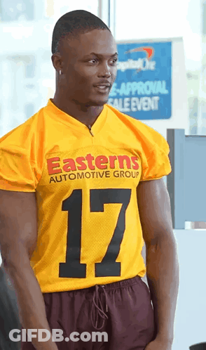 Man In Yellow Jersey Saying Easterns Automotive Group GIF