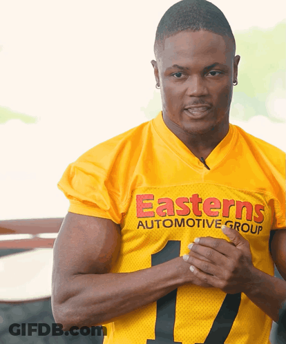 Man In Yellow Jersey Saying Easterns Automotive Group GIF