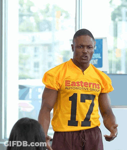 Man In Yellow Jersey Saying Easterns Automotive Group GIF