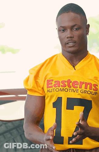 Man In Yellow Jersey Saying Easterns Automotive Group GIF