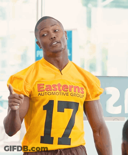 Man In Yellow Jersey Saying Easterns Automotive Group GIF