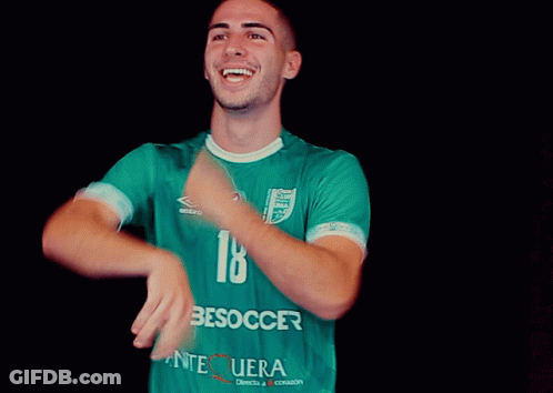 Man In Yellow Jersey Surrounded By People GIF