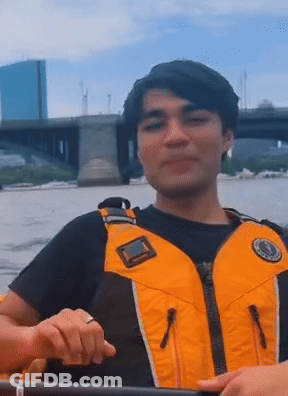Man In Yellow Life Vest Rowing Kayak GIF