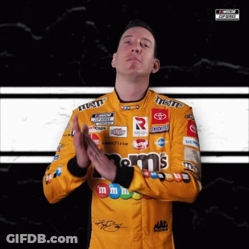 Man In Yellow M&M's Racing Uniform Applauds GIF