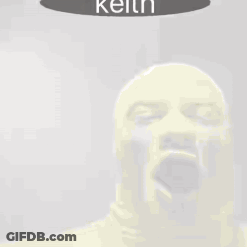 Man In Yellow Mask Yawning With Keith Above GIF