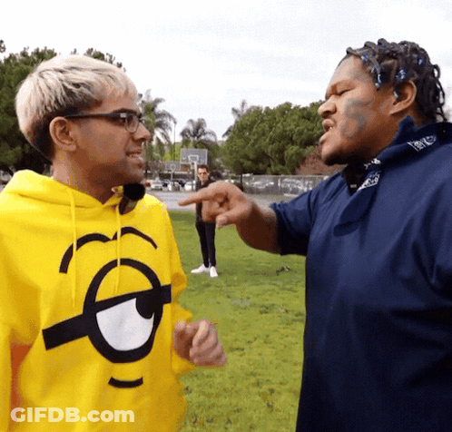 Man In Yellow Minion Hoodie Pointing GIF