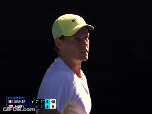 Man In Yellow Nike Hat Looking At Scoreboard GIF