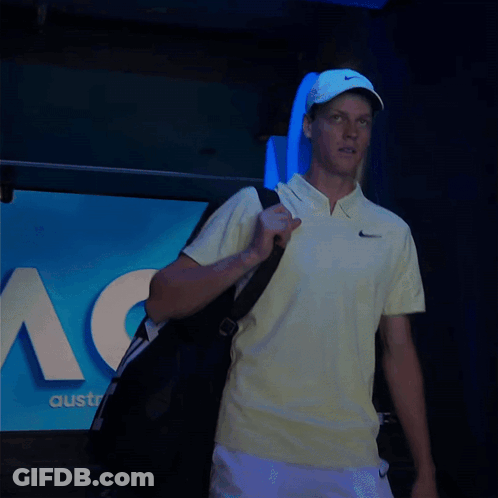 Man In Yellow Nike Shirt Carrying Bag GIF