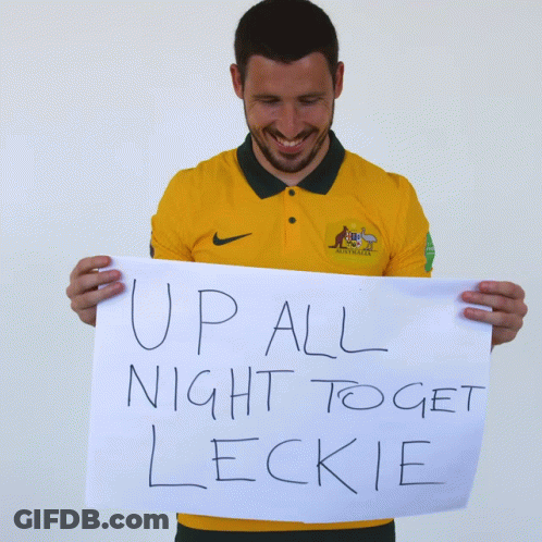 Man In Yellow Nike Shirt Holding Sign Up All Night To Get Leckie GIF