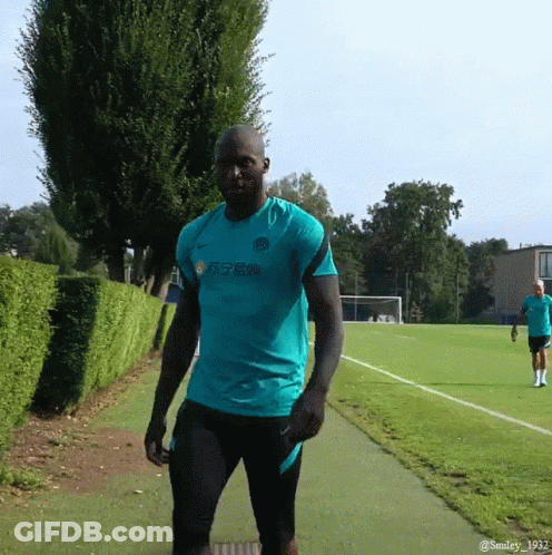 Man In Yellow Nike Vest At Door GIF
