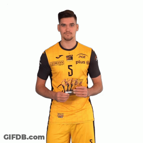 Man In Yellow PGE Jersey Holding Cards GIF