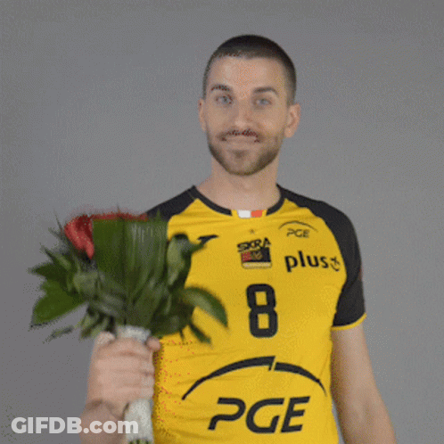 Man In Yellow PGE Shirt Holding Red Roses GIF