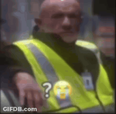 Man In Yellow Safety Vest Sitting With Question Mark GIF