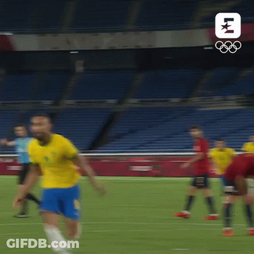 Man In Yellow Shirt And Blue Shorts Running GIF