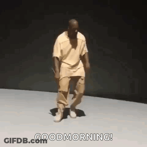 Man In Yellow Shirt And Khaki Pants Dances Good Morning GIF