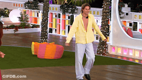 Man In Yellow Shirt And White Pants Dancing GIF