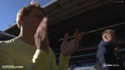 Man In Yellow Shirt Applauding In Front Of BT Sport HD Live Sign GIF