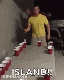 Man In Yellow Shirt At Table With Red Cups And Beer GIF