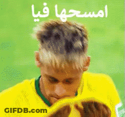 Man In Yellow Shirt Covering Face GIF