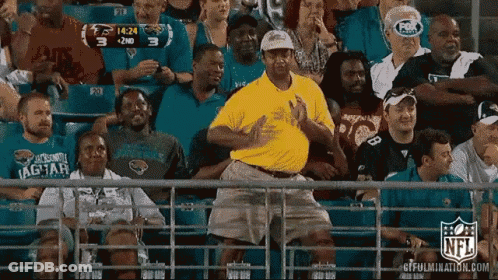 Man In Yellow Shirt Dancing In Stands GIF