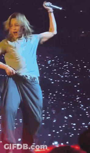 Man In Yellow Shirt Dancing On Stage GIF