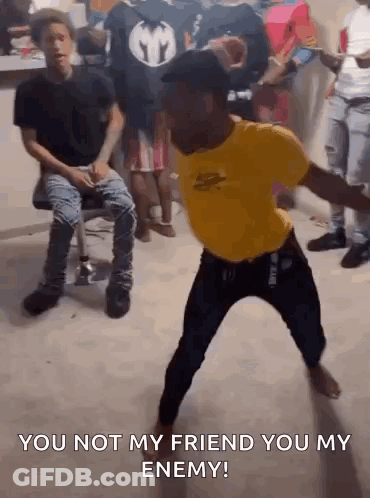 Man In Yellow Shirt Dancing Saying You Not My Friend You My Enemy GIF