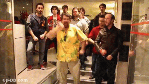Man In Yellow Shirt Dancing With People GIF