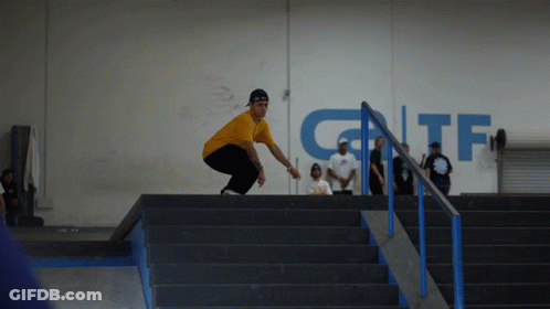 Man In Yellow Shirt Doing Trick On Stairs With GTF Sign GIF