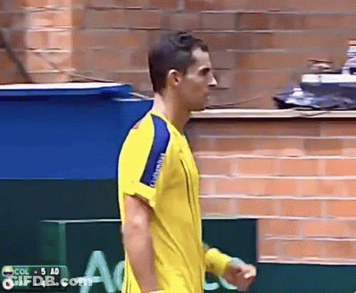 Man In Yellow Shirt Facing Col 5 Ad GIF