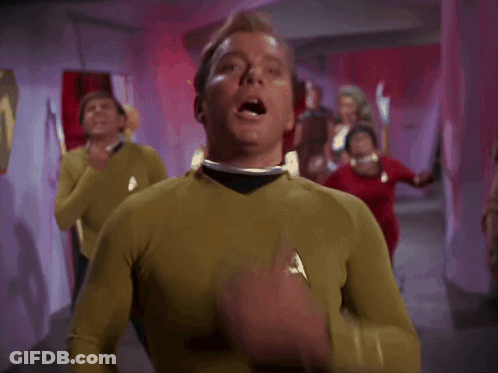 Man In Yellow Shirt Hand Over Mouth GIF