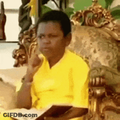 Man In Yellow Shirt Holding Book GIF