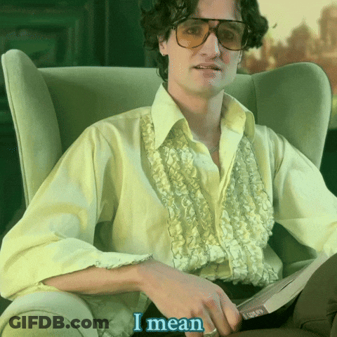 Man In Yellow Shirt Holding Book Saying I Mean GIF