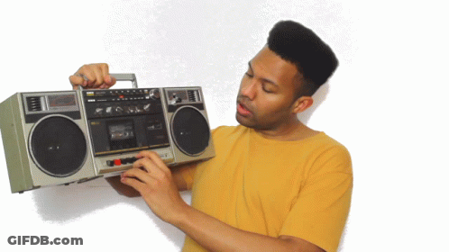 Man In Yellow Shirt Holding Boombox Saying Sanyo GIF