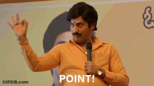Man In Yellow Shirt Holding Microphone Saying Point GIF