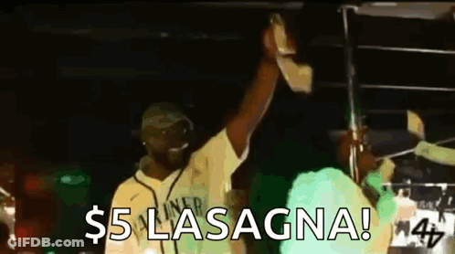Man In Yellow Shirt Holding Microphone Says $5 Lasagna GIF