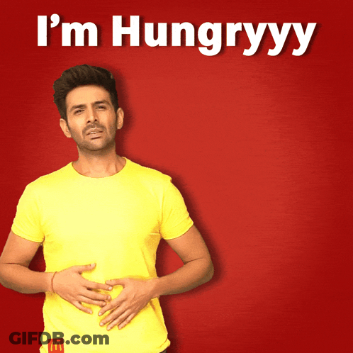 Man In Yellow Shirt Holding Stomach I'm Hungryyy GIF