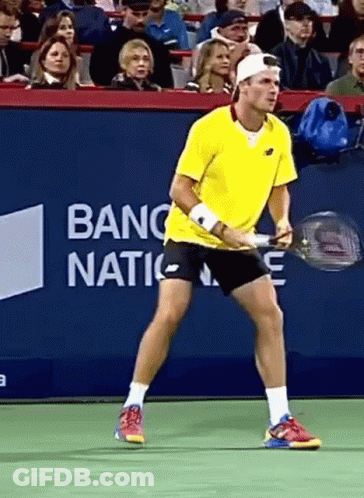 Man In Yellow Shirt Holding Tennis Racquet With Banc Nation Banner GIF