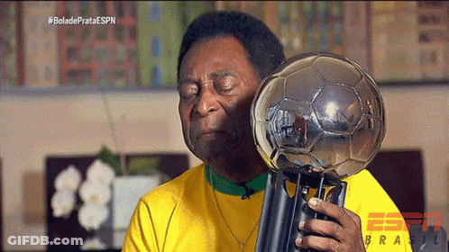 Man In Yellow Shirt Holding Trophy With ESPN Logo GIF