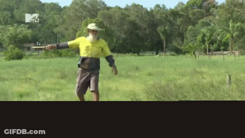 Man In Yellow Shirt In Field GIF