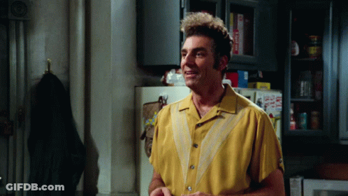 Man In Yellow Shirt In Front Of Fridge With Lucky Charms GIF