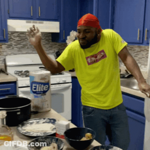 Man In Yellow Shirt In Kitchen GIF