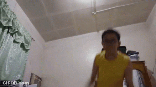 Man In Yellow Shirt Jumping GIF