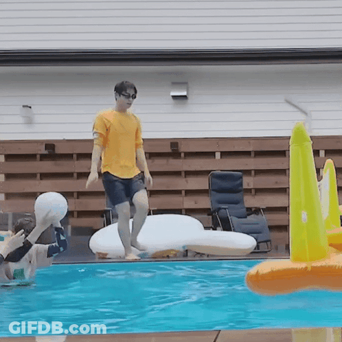 Man In Yellow Shirt Jumping Into Pool GIF