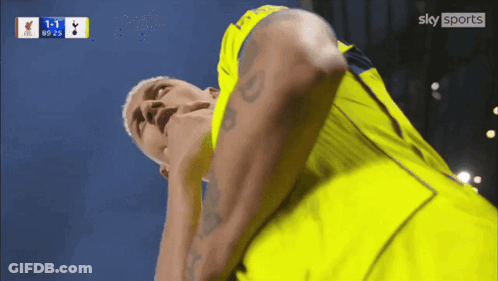 Man In Yellow Shirt Looking At Sky Sports Logo GIF