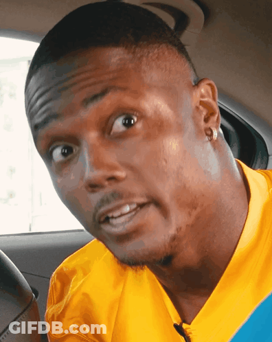Man In Yellow Shirt Making A Face GIF