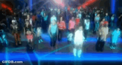Man In Yellow Shirt Next To Man In Red Hat And Woman In Blue Shirt GIF