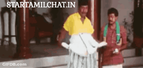 Man In Yellow Shirt Next To Man In Red Shirt GIF
