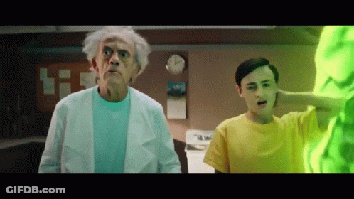 Man In Yellow Shirt Next To Older Man In White Coat GIF