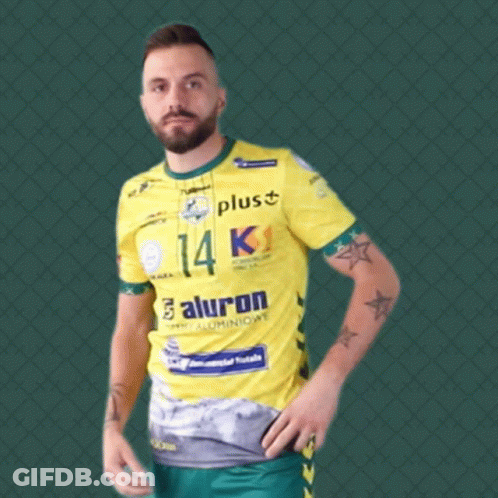 Man In Yellow Shirt Number 5 Holding Shoes GIF